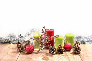 Wall Mural - Candles, jar, wooden star and pinecones on rustic wooden table with Christmas lights and tinsel