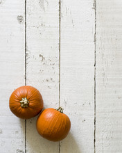 Two Small Orange Pumpkins On White Background