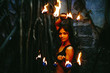 © Artem Zhushman/Stocksy - Pretty fire performer with hand flames