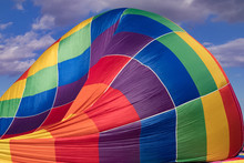 Colorful Hotair Balloon Against Blue Sky With Clouds