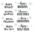 © ollymolly - Hand written New Year phrases. Greeting card text  with snowflakes isolated on white background. Happy holidays lettering in modern calligraphy style. Merry Christmas and Seasons Greetings lettering.