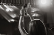 © Vadim - Microphone in female hands close-up. Black and white photo. A pub. Bar. A restaurant. Classical music. Evening. Night show.