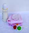 Set for newborn girl with baby milk, toy, little socks and clothes on white background.