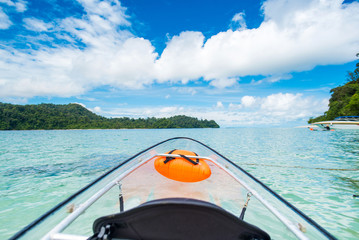 Transparent Canoe Kayak In Tropical Ocean and blue sky,Phuket,Thailand.