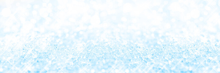Wall Mural - Panoramic blue background of snow, holiday glittering background