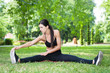 © dobok - young fitness woman exercise in a park in summer