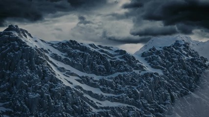 Leinwandbilder - aerial view of snow covered mountains in front of dramatic sky