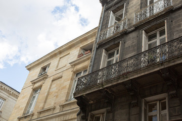 Poster - wash cleaned house facade and a dirty one in a city center town, before and after