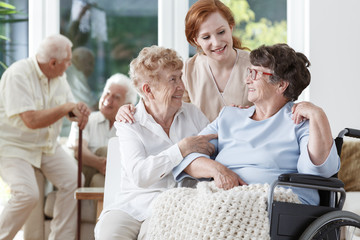 Wall Mural - Nurse and friend supporting lady