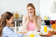 © Syda Productions - happy family having breakfast at home kitchen