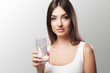 © Maksymiv Iurii - Health, Beauty, Diet. Portrait of a happy smiling young woman who drank water from refreshing water in the morning. Healthy Drinks Healthy Nutrition. Healthy Lifestyle.