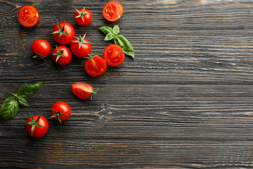 Wall Mural - Fresh cherry tomatoes on wooden background