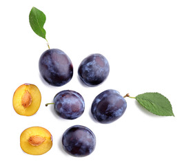 Wall Mural - Fresh ripe plums on white background