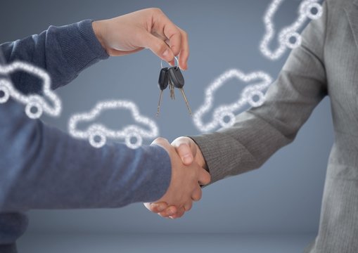 Hands Holding key with cars in front of vignette with handshake