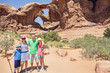 © Brocreative - Family hiking and sightseeing together at Arches National Park