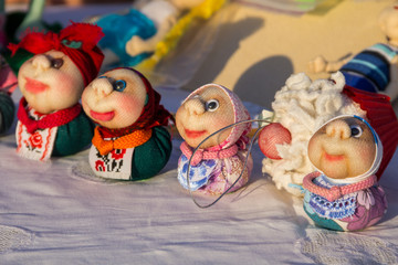 Dolls toys handmade souvenirs at the exhibition of folk arts