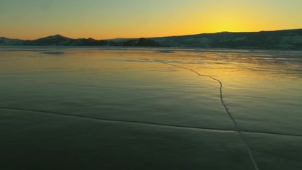 Wall Mural - Winter lake landscape at sunset
