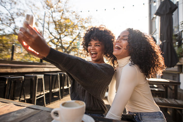 Two young women having fun taking a selfie