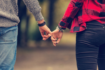 Wall Mural - Couple in love holding hands.