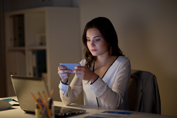 Poster - businesswoman with smartphone and laptop at office