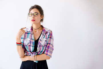 Wall Mural - Close-up portrait of young lady looking under glasses