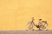 Stylish New Bicycle Near Color Wall Outdoors