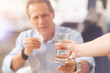 © zinkevych - Close up of a pleasant person holding glass of water