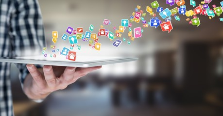 Poster - hand with tablet  with application icons coming up from it.