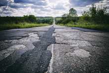 Bad Road With Damaged And Broken Asphalt, Difficult Life Concept