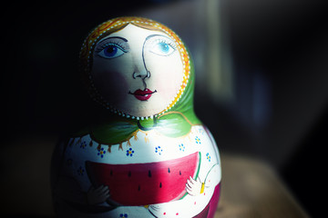 Russian matryoshka with light spot, concept of tradition Russia