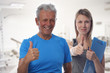 © dream@do - Happy smiling elderly man and and personal trainer showing thumbs up after wokrout. Active , fit, senior man in gym. Sport, recreation, healthy senior lifestyle