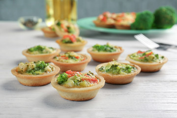 Wall Mural - Broccoli quiche tartlets on table