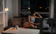 © Marko Milanovic/Stocksy - Beautiful asian woman using technology at her home during evening.