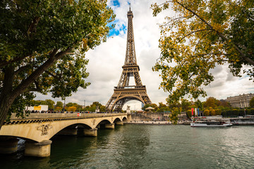 Visitors walking on the bridge to the Eiffel Tower