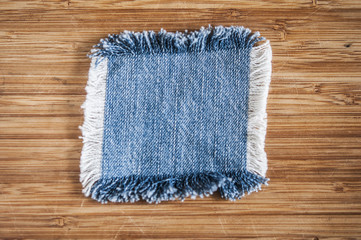 patch jeans on a wooden background