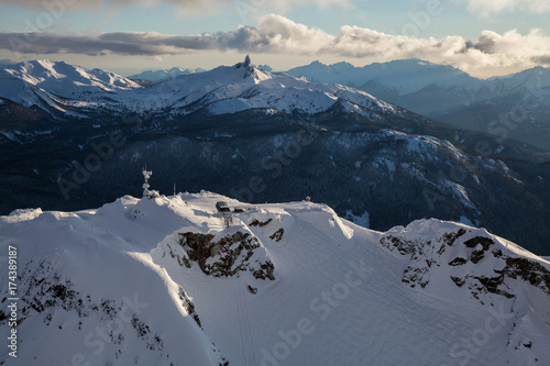 Whistler Mountain, BC, Canada, from an aerial perspective. Picture taken during a cloudy winter sunset.