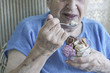 © berna_namoglu - senior woman eating ice cream