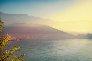 Wall Mural - View of sea, mountains and town scenery. Bay in  Budva (town on Adriatic sea coast, Montenegro). Lightly toned