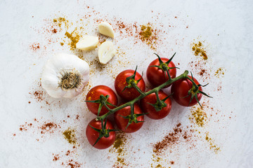 Cherry tomatoes and garlic cloves