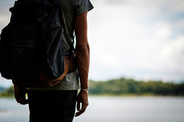  Man traveler traveling walking with backpack at the jungle on holiday at weekend on background nature view