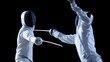 Two Professional Fencers Show Masterful Swordsmanship in their Foil Fight. They Attack, Defend, Leap and Thrust and Lunge. Shot Isolated on Black Background.