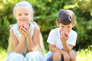 Wall Mural - Cute little children with peaches outdoors