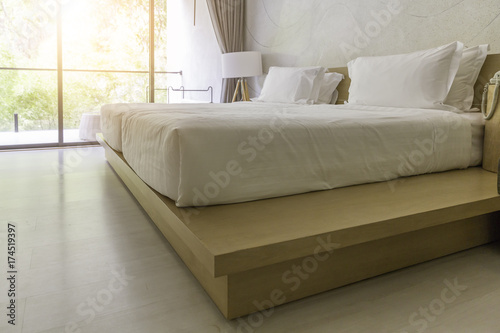 White Bed With Window Light In Modern Style Bedroom In