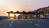 Fototapeta Góry - Cars passing through the toll gate on the motorway, vivid trabel