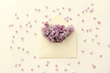 Wall Mural - composition flowers lilac, envelope, flat lay, top view