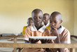 © Hugh Sitton/Stocksy - School girls using tablet computer in the classroom