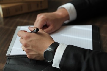 Businessman Signs Paperwork