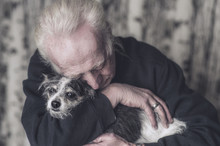 Touching Portrait Of An Older Man With His Dog