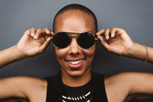 Portrait Of Young Woman With Short Hair And Sunglasses