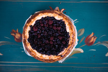 Pie With Berries On A Blue Painted Background